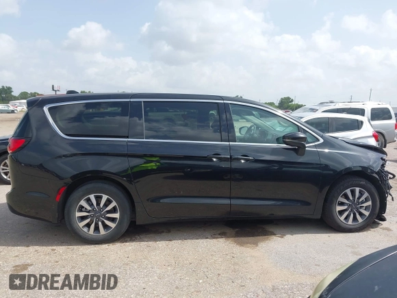 2023 Chrysler Pacifica Hybrid Touring L with VIN 2C4RC1L75PR611901, listed as a IAAI auction lot 42626500 with 44,156 mi miles and . Bid and sale history available at DreamBid. Image 13.