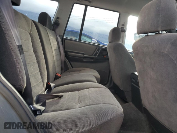 1996 Jeep Grand Cherokee Laredo with VIN 1J4GZ58S3TC245928, listed as a Copart auction lot 57313735 with 165,733 mi miles and Salvage title. Bid and sale history available at DreamBid. Image 11.
