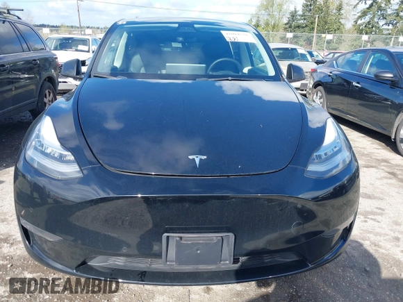2022 Tesla Model Y Long Range with VIN 7SAYGDEEXNF459834, listed as a IAAI auction lot 42004576 with 56,175 mi miles and . Bid and sale history available at carsss.com. Image 12.