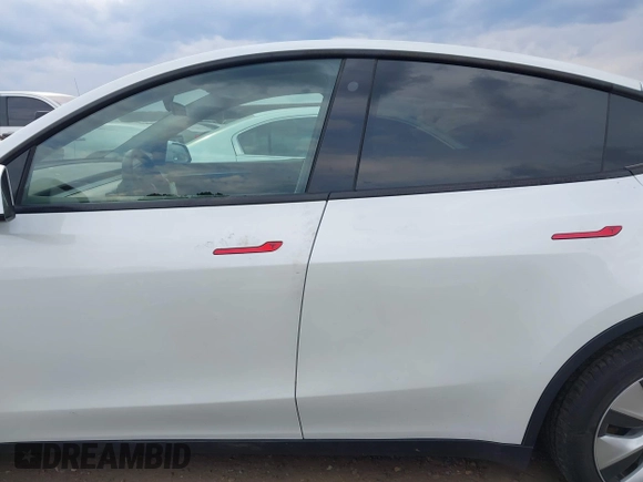 2023 Tesla Model Y Long Range with VIN 7SAYGDEE2PF765395, listed as a IAAI auction lot 41688080 with 27,792 mi miles and . Bid and sale history available at DreamBid. Image 14.