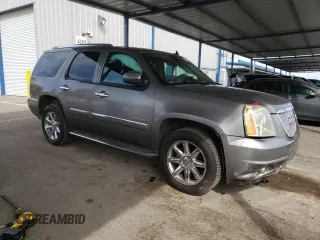 2012 GMC Yukon Denali with VIN 1GKS1EEFXCR236823, listed as a Copart auction lot 49830405 with 134,568 mi miles and Salvage Title. Bid and sale history available at carsss.com. Image 4.