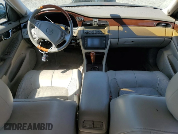 2003 Cadillac DeVille DTS z VIN 1G6KF579X3U233215, wystawiony jako Copart lot #48636775 z przebiegiem 99 144 mil mil oraz Nie do naprawy. Historia ofert i sprzedaży dostępna na DreamBid. Obrazek 8.