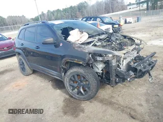 2015 Jeep Cherokee Trailhawk with VIN 1C4PJMBB9FW660478, listed as a IAAI auction lot 41239857 with Not Provided miles and . Bid and sale history available at carsss.com. Image 1.