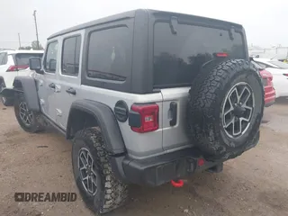 2024 Jeep Wrangler Rubicon with VIN 1C4PJXFG7RW252959, listed as a IAAI auction lot 41955302 with 27,727 mi miles and . Bid and sale history available at DreamBid. Image 3.