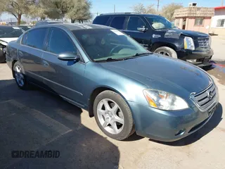 2002 Nissan Altima SE with VIN 1N4BL11D72C700998, listed as a IAAI auction lot 41369017 with 117,148 mi miles. Bid and sale history available at carsss.com. Image 1.