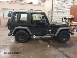 2003 Jeep Wrangler Sport Right Hand Drive with VIN 1J4F449S63P359031, listed as a IAAI auction lot 41495087 with 126,678 mi miles. Bid and sale history available at carsss.com. Image 13.