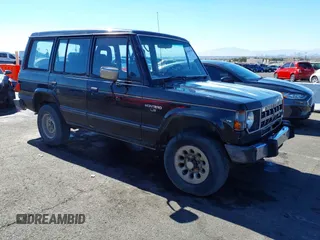 1990 Mitsubishi Montero z VIN JA4GJ51S9LJ002086, wystawiony jako IAAI lot #41643120 z przebiegiem 198 215 mil mil oraz . Historia ofert i sprzedaży dostępna na DreamBid. Obrazek 1.