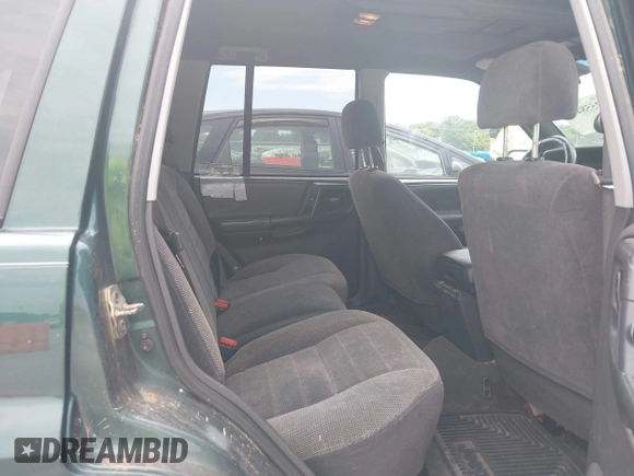 1998 Jeep Grand Cherokee Laredo with VIN 1J4GZ58S7WC284106, listed as a IAAI auction lot 42558498 with 316,354 mi miles and . Bid and sale history available at DreamBid. Image 8.