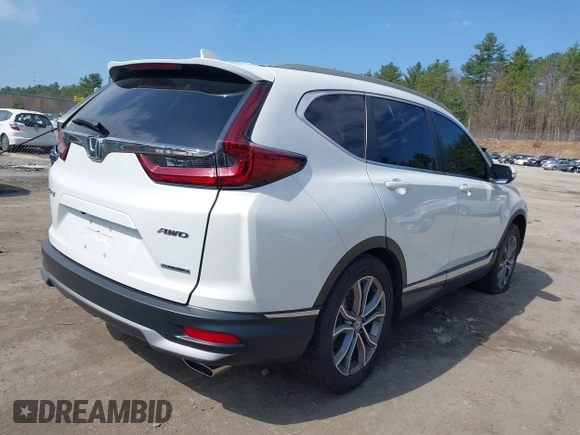 2020 Honda CR-V Touring z VIN 2HKRW2H9XLH623380, wystawiony jako IAAI lot #42039028 z przebiegiem 59 795 mil mil oraz . Historia ofert i sprzedaży dostępna na DreamBid. Obrazek 4.