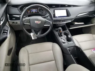 2021 Cadillac XT4 FWD Premium Luxury with VIN 1GYFZCR48MF083164, listed as a Copart auction lot 55377235 with 63,987 mi miles and Salvage title. Bid and sale history available at DreamBid. Image 8.