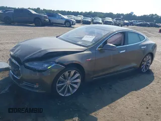2016 Tesla Model S 70 with VIN 5YJSA1E1XGF126620, listed as a IAAI auction lot 40227035 with 71,400 mi miles and . Bid and sale history available at DreamBid. Image 2.