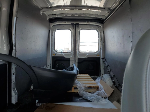 2016 Ford Transit Cargo z VIN 1FTYR2CM3GKB31134, wystawiony jako Copart lot #70293794 z przebiegiem 65 457 mil mil oraz Szkoda całkowita • Salvage title. Historia ofert i sprzedaży dostępna na DreamBid. Obrazek 10.
