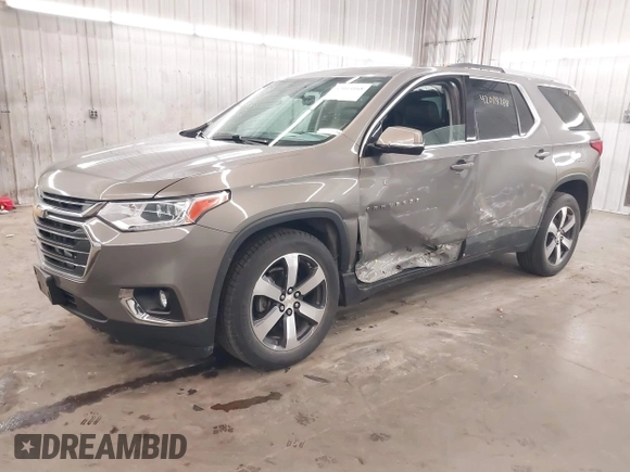 2018 Chevrolet Traverse LT z VIN 1GNEVHKW0JJ166321, wystawiony jako IAAI lot #42014168 z przebiegiem 81 442 mil mil oraz . Historia ofert i sprzedaży dostępna na DreamBid. Obrazek 2.