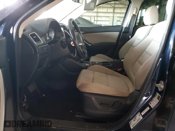 2016 Mazda CX-5 Touring with VIN JM3KE2CY7G0653854, listed as a Copart auction lot 74825564 with 139,193 mi miles and Salvage Title. Bid and sale history available at DreamBid. Image 7.