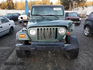 2000 Jeep Wrangler Sport with VIN 1J4FA49S1YP748529, listed as a Copart auction lot 77041924 with 154,949 mi miles and Salvage Title. Bid and sale history available at carsss.com. Image 5.