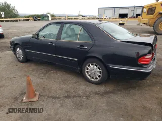 2000 Mercedes-Benz E-Class with VIN WDBJF65J5YB068297, listed as a Copart auction lot 69199004 with 236,751 mi miles and Salvage Title. Bid and sale history available at carsss.com. Image 2.