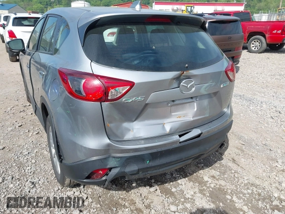 2014 Mazda CX-5 Sport with VIN JM3KE2BE9E0423737, listed as a IAAI auction lot 42222646 with 116,160 mi miles and . Bid and sale history available at DreamBid. Image 6.