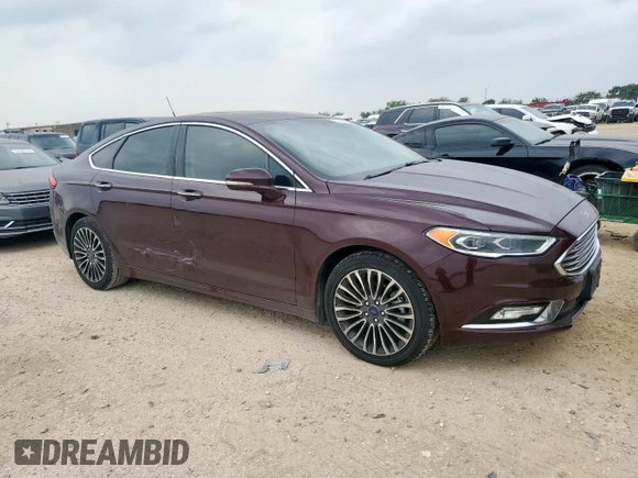 2017 Ford Fusion Titanium with VIN 3FA6P0K90HR178834, listed as a Copart auction lot 57420795 with 127,977 mi miles and Salvage title. Bid and sale history available at DreamBid. Image 4.