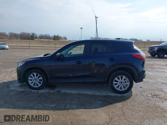 2015 Mazda CX-5 Touring with VIN JM3KE2CY0F0516589, listed as a IAAI auction lot 41707973 with 109,245 mi miles. Bid and sale history available at carsss.com. Image 14.