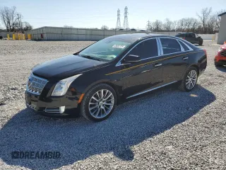 2013 Cadillac XTS Platinum z VIN 2G61U5S31D9149982, wystawiony jako Copart lot #49682725 z przebiegiem 123 095 mil mil oraz Szkoda całkowita • Salvage title. Historia ofert i sprzedaży dostępna na DreamBid. Obrazek 1.