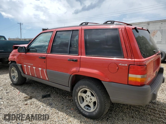 1997 Jeep Grand Cherokee Laredo with VIN 1J4GZ58S3VC739922, listed as a Copart auction lot 55667885 with 209,075 mi miles and Salvage title. Bid and sale history available at DreamBid. Image 2.