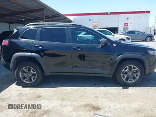 2019 Jeep Cherokee Trailhawk Elite with VIN 1C4PJMBX0KD198328, listed as a IAAI auction lot 42085194 with 76,312 mi miles and . Bid and sale history available at DreamBid. Image 14.