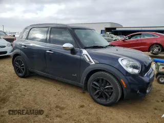 2011 MINI Countryman S with VIN WMWZC5C53BWH99985, listed as a Copart auction lot 89191125 with 90,177 mi miles and Salvage Title. Bid and sale history available at DreamBid. Image 4.