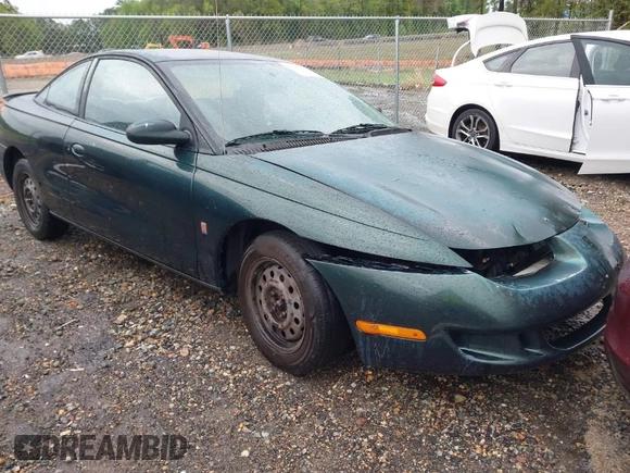 1997 Saturn SC z VIN 1G8ZG1277VZ342397, wystawiony jako IAAI lot #41966570 z przebiegiem 184 054 mil mil oraz . Historia ofert i sprzedaży dostępna na DreamBid. Obrazek 1.
