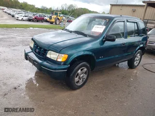 2000 Kia Sportage with VIN KNDJA7233Y5685000, listed as a IAAI auction lot 42005169 with 221,447 mi miles. Bid and sale history available at carsss.com. Image 2.