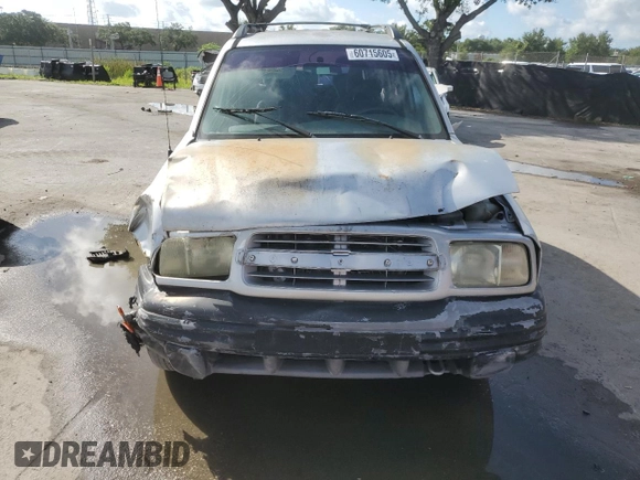 2003 Chevrolet Tracker with VIN 2CNBE13C836953178, listed as a Copart auction lot 60715605 with 128,978 mi miles and Salvage title. Bid and sale history available at DreamBid. Image 5.