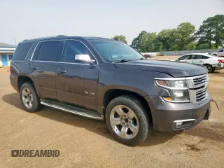 2015 Chevrolet Tahoe LTZ z VIN 1GNSCCKC8FR102859, wystawiony jako Copart lot #56755555 z przebiegiem 167 191 mil mil oraz Czysty tytuł • Clean title. Historia ofert i sprzedaży dostępna na DreamBid. Obrazek 4.