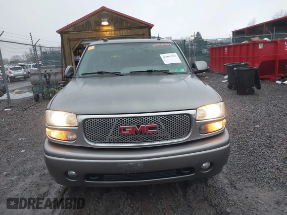 2005 GMC Yukon Denali z VIN 1GKEK63U25J228296, wystawiony jako IAAI lot #40980307 z przebiegiem 192 353 mil mil oraz . Historia ofert i sprzedaży dostępna na DreamBid. Obrazek 12.