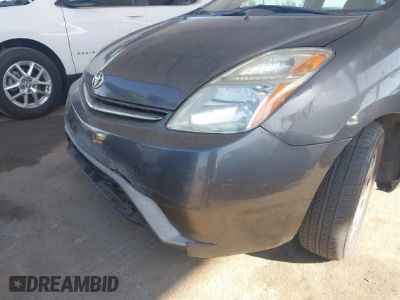 2007 Toyota Prius z VIN JTDKB20U873226409, wystawiony jako IAAI lot #42541909 z przebiegiem 128 374 mil mil oraz . Historia ofert i sprzedaży dostępna na DreamBid. Obrazek 6.