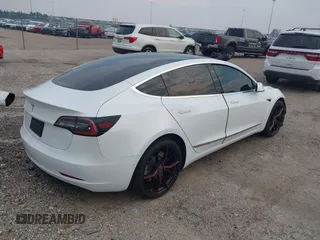 2019 Tesla Model 3 Mid Range with VIN 5YJ3E1EA8KF472540, listed as a IAAI auction lot 41661312 with 75,575 mi miles and . Bid and sale history available at DreamBid. Image 4.