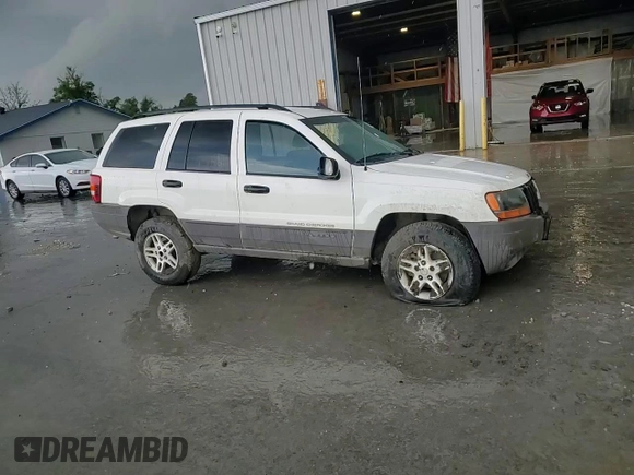 2004 Jeep Grand Cherokee Laredo z VIN 1J4GW48S74C165732, wystawiony jako Copart lot #56316885 z przebiegiem 177 139 mil mil oraz Szkoda całkowita • Salvage title. Historia ofert i sprzedaży dostępna na DreamBid. Obrazek 15.