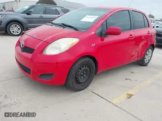 2009 Toyota Yaris with VIN JTDKT903295244022, listed as a IAAI auction lot 41615570 with 165,964 mi miles. Bid and sale history available at carsss.com. Image 18.