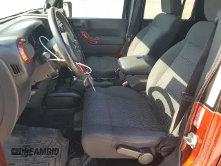 2012 Jeep Wrangler Unlimited Sport with VIN 1C4BJWDG0CL200802, listed as a Copart auction lot 63822365 with 116,501 mi miles and Salvage title. Bid and sale history available at DreamBid. Image 7.