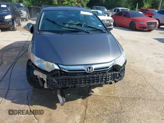2013 Honda Insight EX with VIN JHMZE2H74DS002123, listed as a IAAI auction lot 42204860 with 279,376 mi miles and . Bid and sale history available at DreamBid. Image 6.