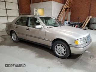 1995 Mercedes-Benz C with VIN WDBHA28E8SF115598, listed as a Copart auction lot 50145195 with 129,134 mi miles and Clean Title. Bid and sale history available at carsss.com. Image 4.
