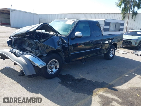 2002 Ford F-150 XL with VIN 1FTRX17L02NB79722, listed as a IAAI auction lot 41538404 with 202,050 mi miles. Bid and sale history available at carsss.com. Image 2.