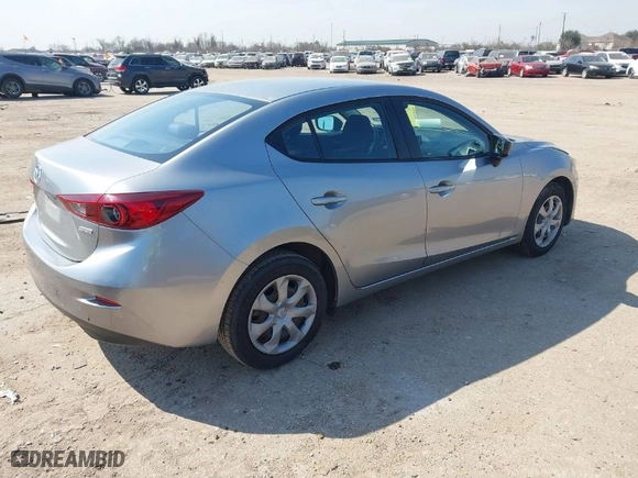 2014 Mazda Mazda3 i SV with VIN JM1BM1T77E1184656, listed as a IAAI auction lot 41703402 with 57,025 mi miles. Bid and sale history available at carsss.com. Image 4.
