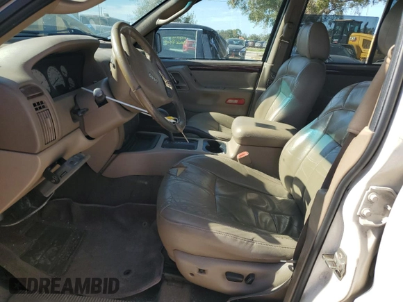 2002 Jeep Grand Cherokee Limited with VIN 1J4GX58S32C320843, listed as a Copart auction lot 77663864 with 289,537 mi miles and Salvage Title. Bid and sale history available at DreamBid. Image 7.