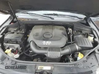 2014 Jeep Grand Cherokee Laredo with VIN 1C4RJEAGXEC130094, listed as a Copart auction lot 55997925 with 151,407 mi miles and Salvage Title. Bid and sale history available at DreamBid. Image 11.