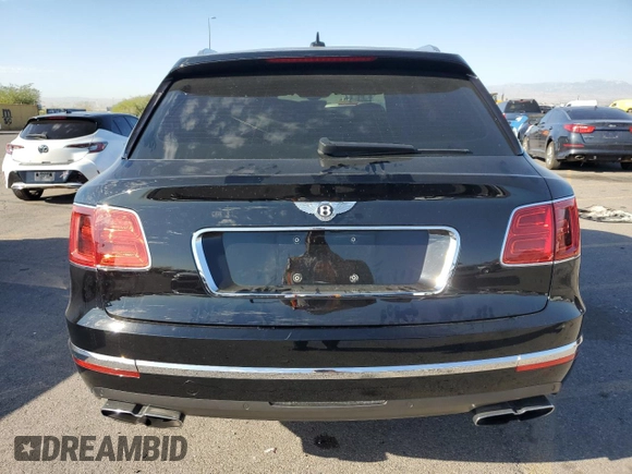 2019 Bentley Bentayga V8 z VIN SJAAM2ZV5KC024154, wystawiony jako Copart lot #74990344 z przebiegiem 41 589 mil mil oraz Szkoda całkowita • Salvage title. Historia ofert i sprzedaży dostępna na DreamBid. Obrazek 6.