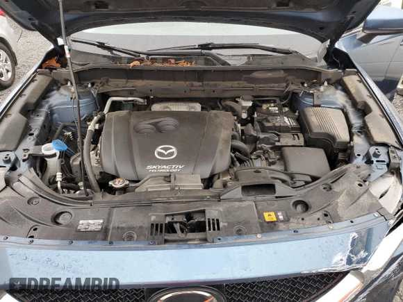 2017 Mazda CX-5 Touring with VIN JM3KFBCLXH0124451, listed as a Copart auction lot 51060275 with 126,807 mi miles and Salvage Title. Bid and sale history available at carsss.com. Image 12.