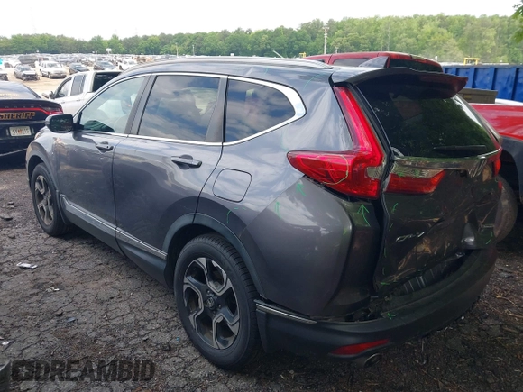 2018 Honda CR-V Touring z VIN 7FARW1H9XJE040530, wystawiony jako IAAI lot #42227446 z przebiegiem 101 299 mil mil oraz . Historia ofert i sprzedaży dostępna na DreamBid. Obrazek 3.