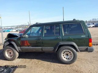1996 Jeep Cherokee Sport with VIN 1J4FJ68S2TL299150, listed as a IAAI auction lot 41932867 with 142,761 mi miles. Bid and sale history available at carsss.com. Image 14.