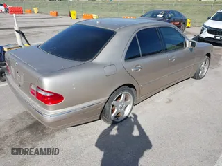 2001 Mercedes-Benz E-Class with VIN WDBJF65J61B251908, listed as a IAAI auction lot 41800893 with 187,178 mi miles. Bid and sale history available at carsss.com. Image 4.