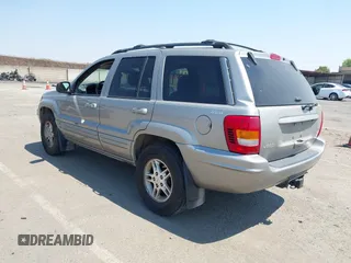 2000 Jeep Grand Cherokee Limited with VIN 1J4GW58N5YC361724, listed as a IAAI auction lot 42722980 with 136,590 mi miles and . Bid and sale history available at DreamBid. Image 3.