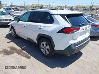 2019 Toyota RAV4 Hybrid LE with VIN 2T3MWRFV2KW026931, listed as a IAAI auction lot 42667582 with 93,147 mi miles and . Bid and sale history available at DreamBid. Image 3.